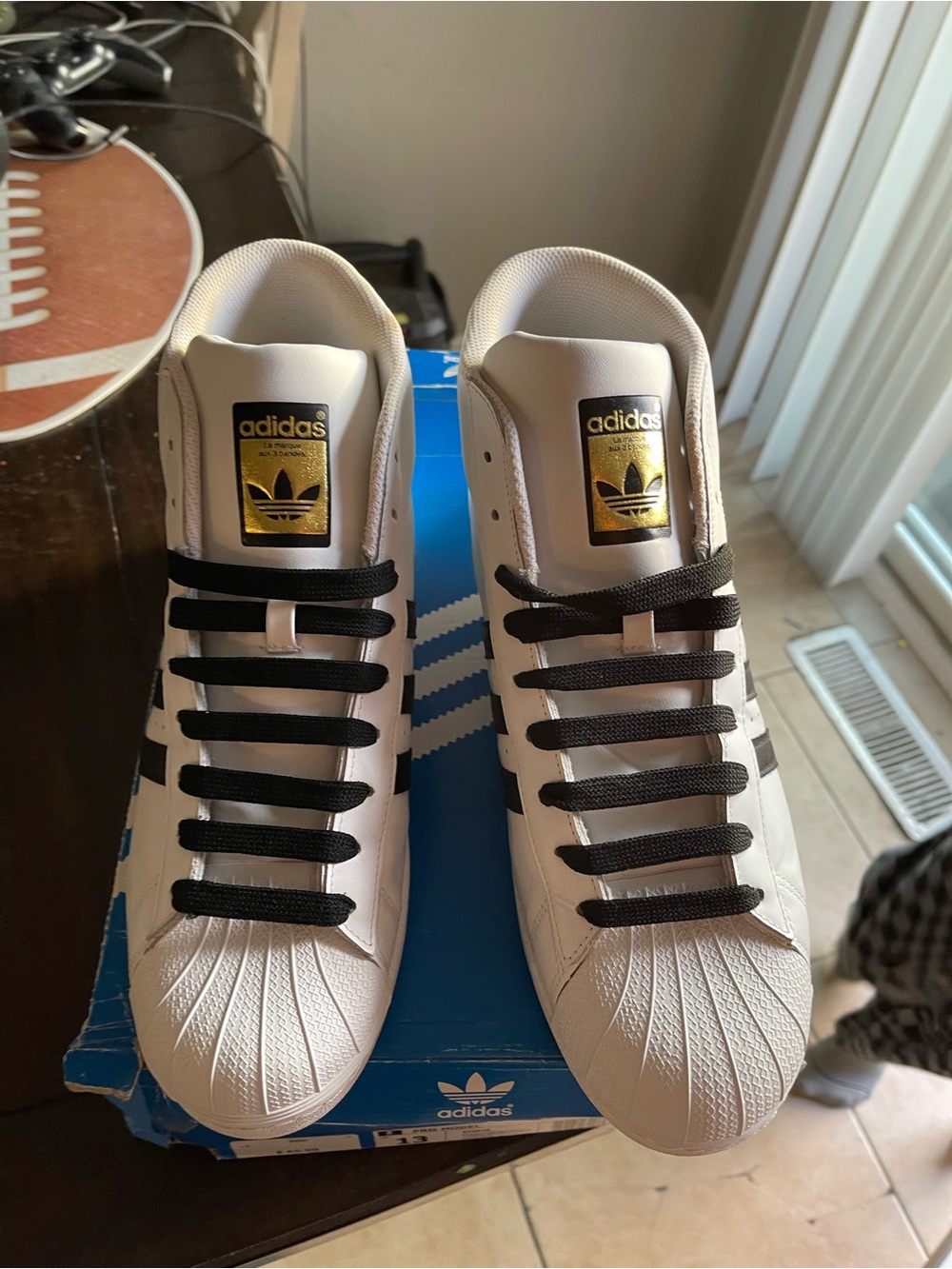 adidas White Sneakers with Black Stripes and Gold Tongue Patch